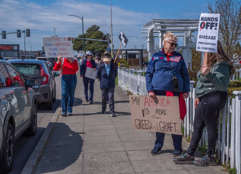 Sequim Gazette photo by Emily Matthiessen/ According to a clicker count by volunteers with Sequim Indivisible, 1298 people turned out by 11:45 a.m., with nearly 1400 people counted by 2:00 p.m. during Sequim's version of the "Hands Off " protests held across the nation and in other countries on Saturday. The protest was peaceful and orderly, according to police, organizers and protesters and featured a range of protest signs.
