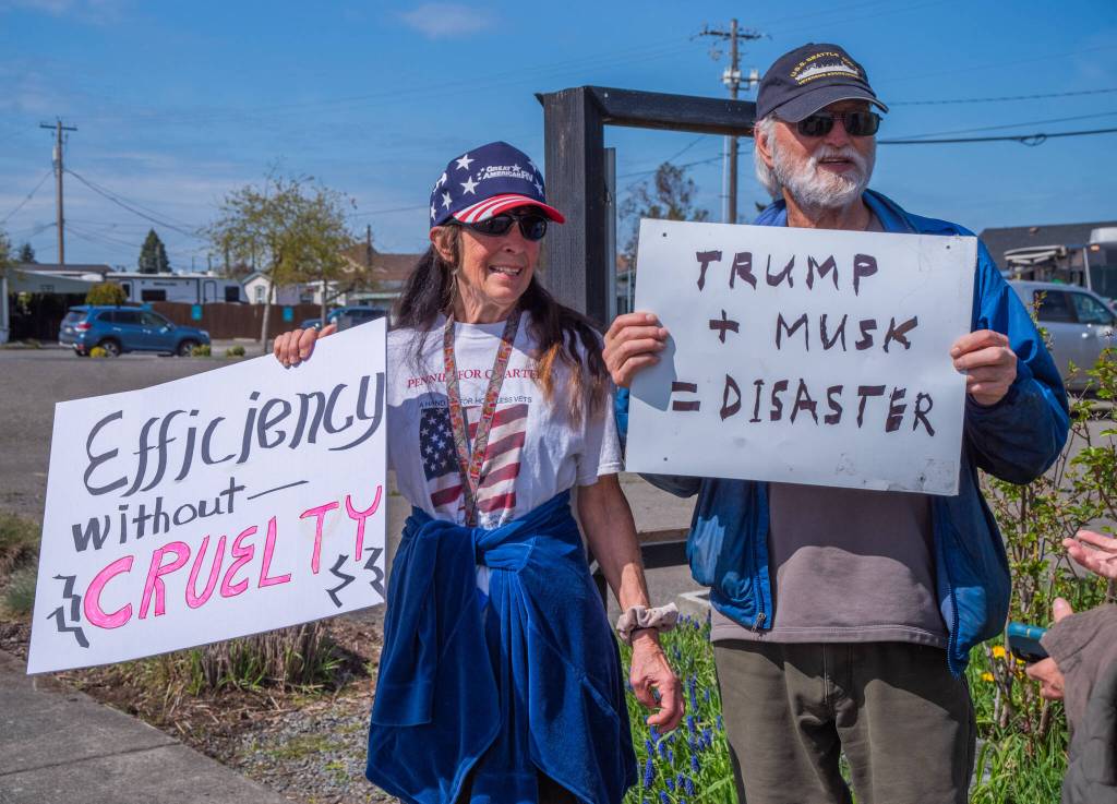 Sequim Gazette photo by Emily Matthiessen/ According to a clicker count by volunteers with Sequim Indivisible, 1298 people turned out by 11:45 a.m., with nearly 1400 people counted by 2:00 p.m. during Sequim's version of the "Hands Off " protests held across the nation and in other countries on Saturday. The protest was peaceful and orderly, according to police, organizers and protesters and featured a range of protest signs.