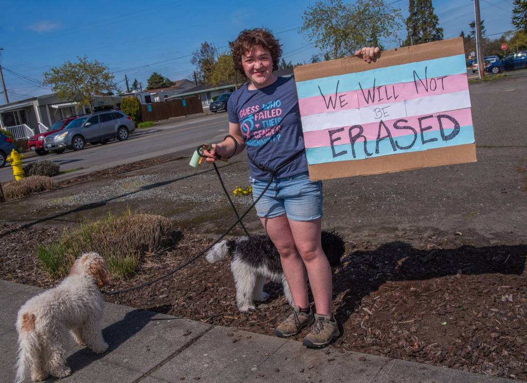 Sequim Gazette photo by Emily Matthiessen/ According to a clicker count by volunteers with Sequim Indivisible, 1298 people turned out by 11:45 a.m., with nearly 1400 people counted by 2:00 p.m. during Sequim's version of the "Hands Off " protests held across the nation and in other countries on Saturday. The protest was peaceful and orderly, according to police, organizers and protesters and featured a range of protest signs.