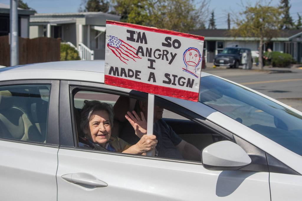 Sequim Gazette photo by Emily Matthiessen/ According to a clicker count by volunteers with Sequim Indivisible, 1298 people turned out by 11:45 a.m., with nearly 1400 people counted by 2:00 p.m. during Sequim's version of the "Hands Off " protests held across the nation and in other countries on Saturday. The protest was peaceful and orderly, according to police, organizers and protesters and featured a range of protest signs.
