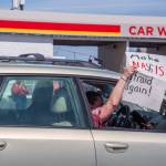 Sequim Gazette photo by Emily Matthiessen/ According to a clicker count by volunteers with Sequim Indivisible, 1298 people turned out by 11:45 a.m., with nearly 1400 people counted by 2:00 p.m. during Sequim's version of the "Hands Off " protests held across the nation and in other countries on Saturday. The protest was peaceful and orderly, according to police, organizers and protesters and featured a range of protest signs.