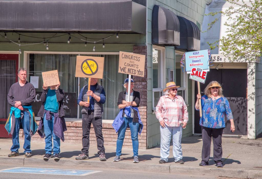 Sequim Gazette photo by Emily Matthiessen/ According to a clicker count by volunteers with Sequim Indivisible, 1298 people turned out by 11:45 a.m., with nearly 1400 people counted by 2:00 p.m. during Sequim's version of the "Hands Off " protests held across the nation and in other countries on Saturday. The protest was peaceful and orderly, according to police, organizers and protesters and featured a range of protest signs.