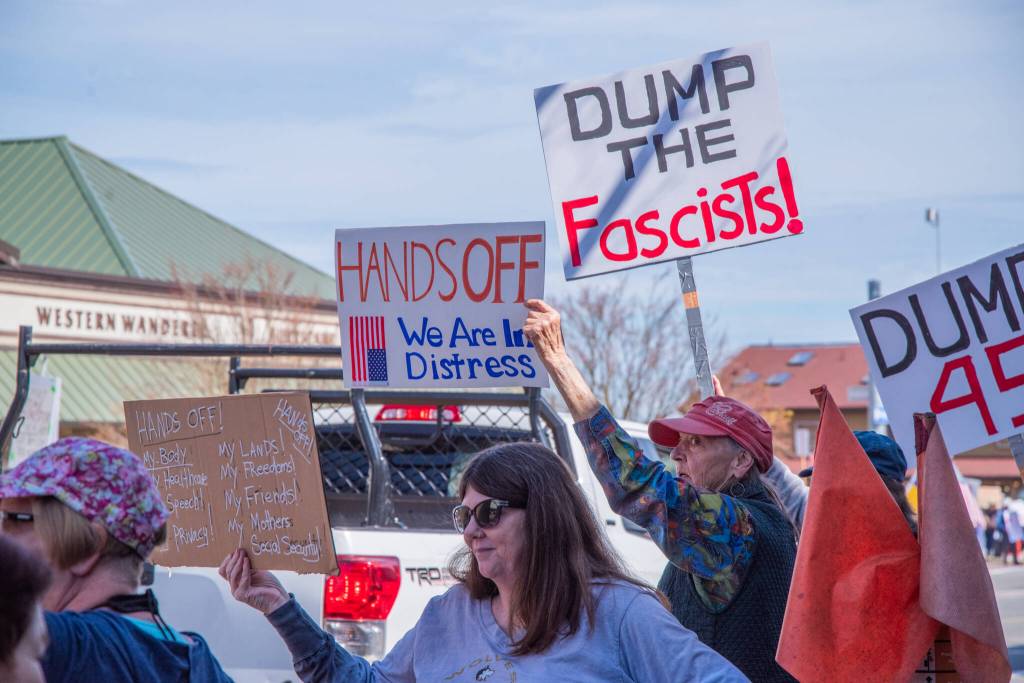 Sequim Gazette photo by Emily Matthiessen/ According to a clicker count by volunteers with Sequim Indivisible, 1298 people turned out by 11:45 a.m., with nearly 1400 people counted by 2:00 p.m. during Sequim's version of the "Hands Off " protests held across the nation and in other countries on Saturday. The protest was peaceful and orderly, according to police, organizers and protesters and featured a range of protest signs.
