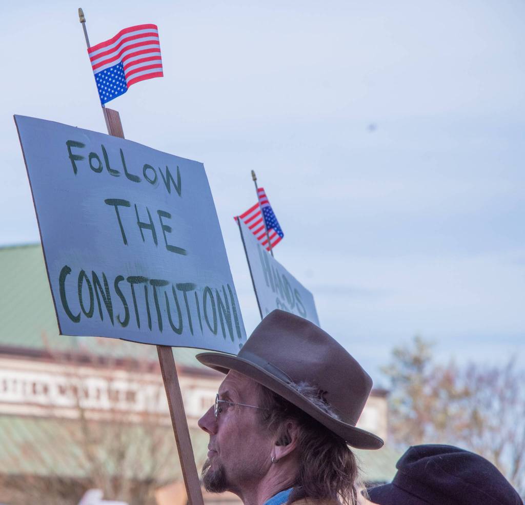 Sequim Gazette photo by Emily Matthiessen/ According to a clicker count by volunteers with Sequim Indivisible, 1298 people turned out by 11:45 a.m., with nearly 1400 people counted by 2:00 p.m. during Sequim's version of the "Hands Off " protests held across the nation and in other countries on Saturday. The protest was peaceful and orderly, according to police, organizers and protesters and featured a range of protest signs.