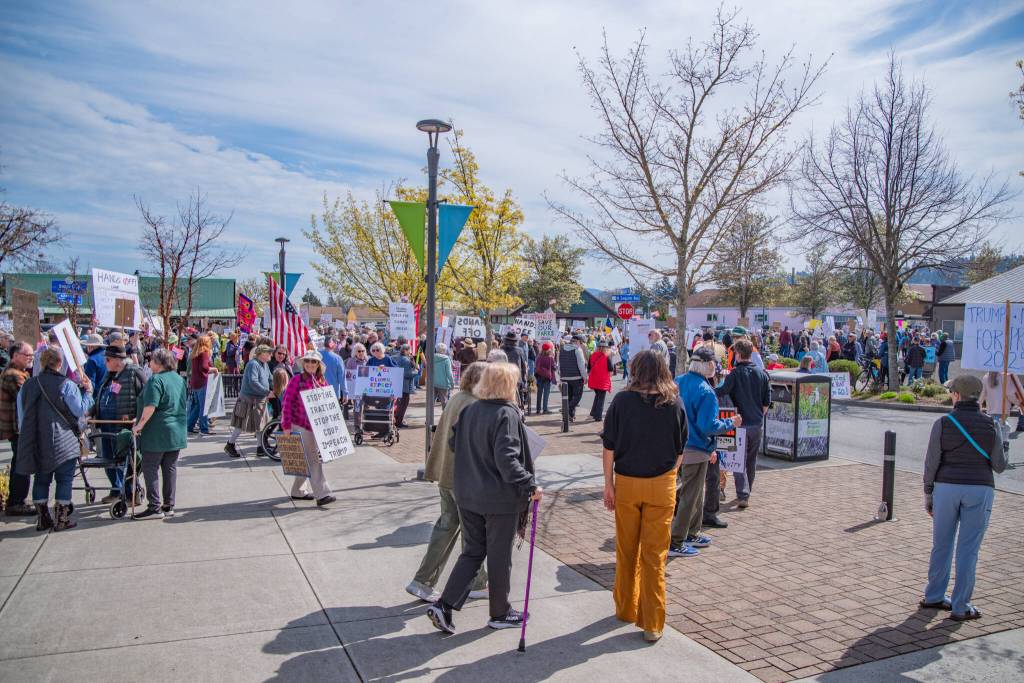 Sequim Gazette photo by Emily Matthiessen/ According to a clicker count by volunteers with Sequim Indivisible, 1298 people turned out by 11:45 a.m., with nearly 1400 people counted by 2:00 p.m. during Sequims version of the Hands Off  protests held across the nation and in other countries on Saturday. The protest was peaceful and orderly, according to police, organizers and protesters and featured a range of protest signs.