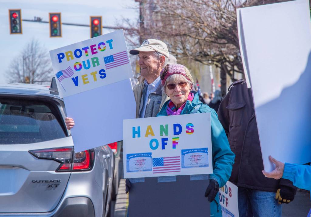 Sequim Gazette photo by Emily Matthiessen/ According to a clicker count by volunteers with Sequim Indivisible, 1298 people turned out by 11:45 a.m., with nearly 1400 people counted by 2:00 p.m. during Sequim's version of the "Hands Off " protests held across the nation and in other countries on Saturday. The protest was peaceful and orderly, according to police, organizers and protesters and featured a range of protest signs.