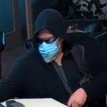 Photo courtesy Sequim Police Department/ On April 10, Sequim Police Department released screenshots of video surveillance of a man who is alleged to have robbed Kitsap Bank in Sequim on April 9. Police describe the Caucasian male as standing about 6 tall with a gray beard and heavy build.