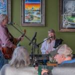 Sequim Gazette photo by Emily Matthiessen/ Steve Anderson on guitar and Dawn Martin on piano, sing and play for a crowded Rainshadow Cafe last First Friday Art Walk in Sequim.