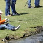 Sequim Gazette photo by Matthew Nash/ Jade Harper, 8, awaits a fish on her line during an April 18 Kids Fishing Day preview for a few Sequim students.