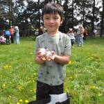 Five-year-old River Roberts of Port Angeles shows one of the many eggs he found during one of the hunts at the Sequim Elks Lodge on April 19. It was his first time at the event, his family said. He gave it a thumbs up.