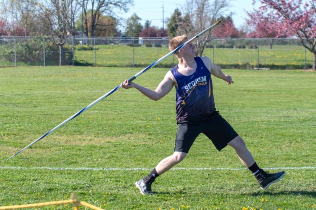 Sequim Gazette photo by Emily Mathiessen/ Gavin Albers makes a throw in a home meet on April 17.