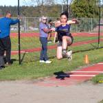 Sequim Gazette photo by Emily Mathiessen/ Ahrya Klinger jumps during a home meet in Sequim on April 17.