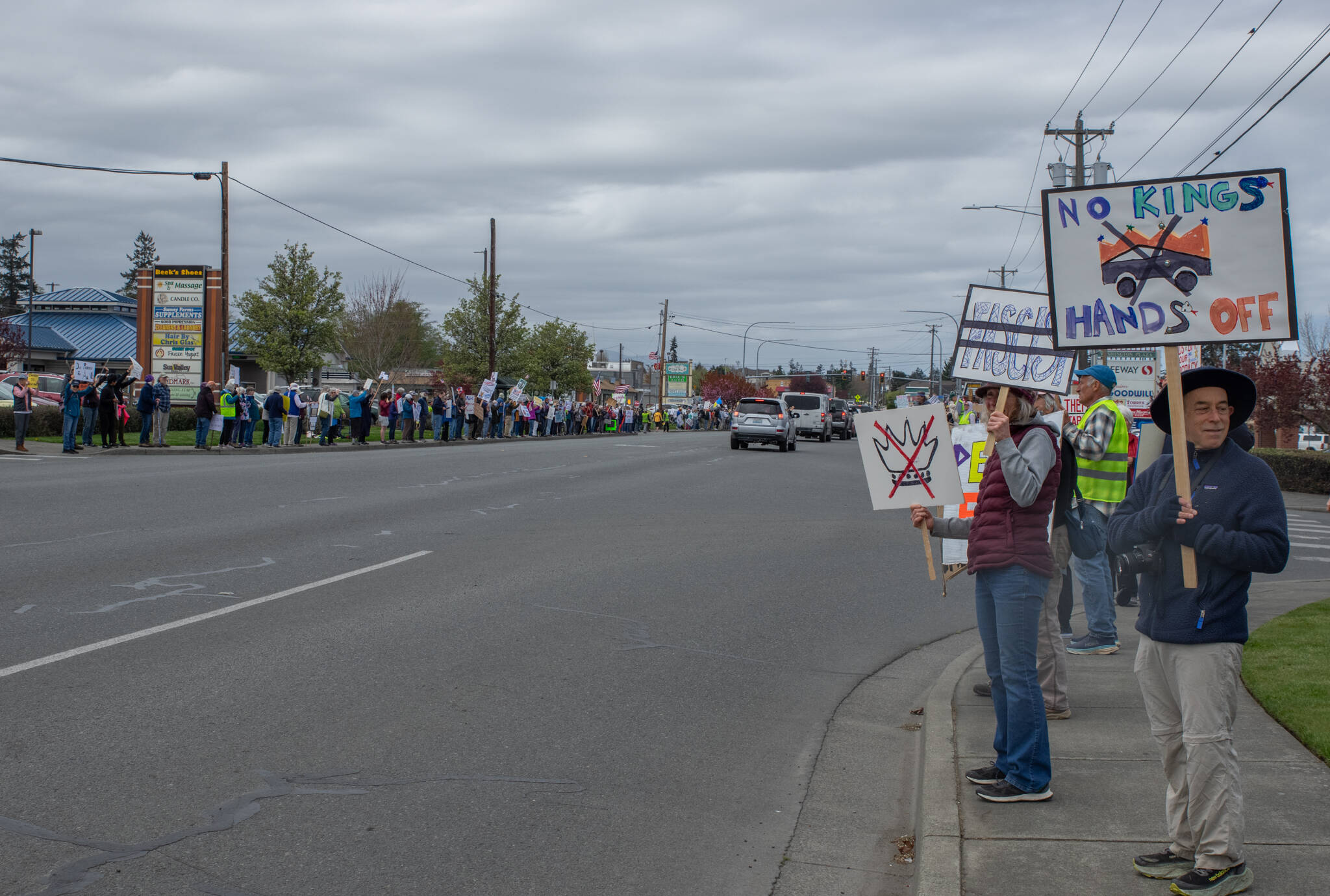 Sequim Gazette photo by Emily Matthiessen/ Lines of protestors stood from near Dairy Queen on Washington St and 7th Ave to near West Side Pizza, at least 500 according to Chris Walker. We got a pretty good count even with the ebb and flow of people coming and going, said Walker. It was a peaceful event with people connecting with each other in solidarity.