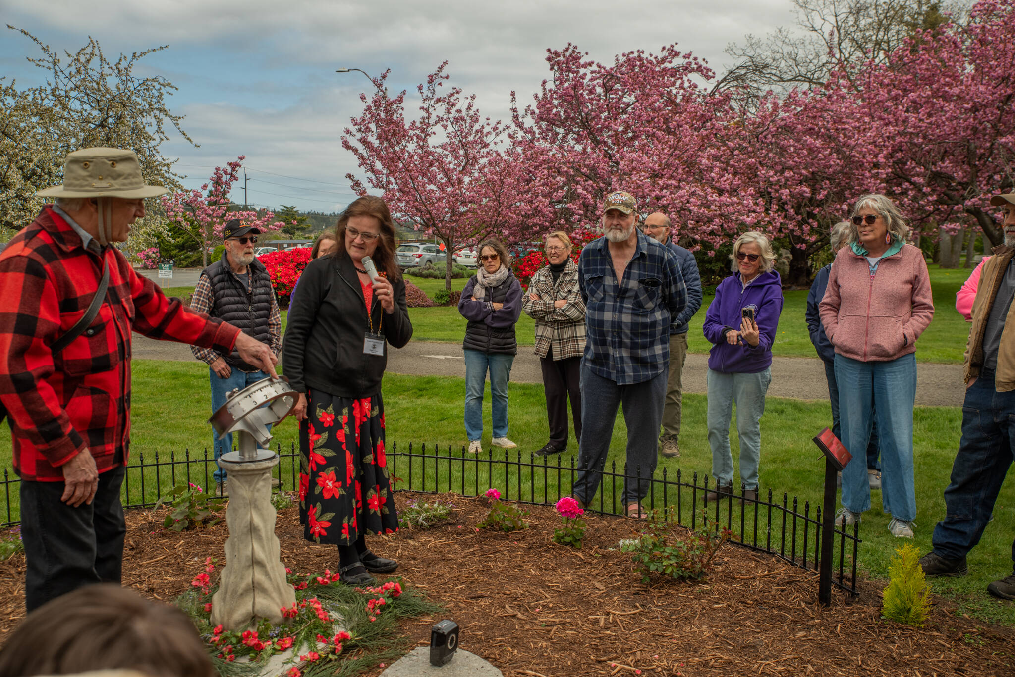 Sequim Gazette photo by Emily Matthiessen/ Joe LaCour explains to an audience of pioneer descendants, Sequim Prairie Garden Club members and others how he made the new sundial for Pioneer Memorial Park, which was dedicated during a ceremony on Saturday, April 19. The garden club also dedicated the refurbished Remembrance Garden.