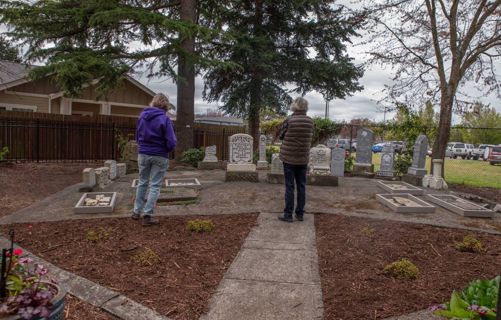 Sequim Gazette photo by Emily Matthiessen/ Pioneer Memorial Parks Memorial Garden is viewed by participants in Saturdays dedication ceremony.