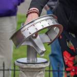 Sequim Gazette photo by Emily Matthiessen/ Della LaCour points at the new sundial at Pioneer Memorial Park.