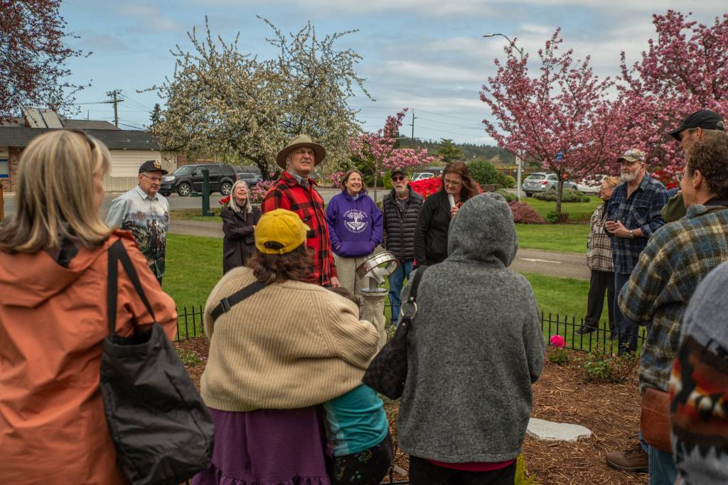 Sequim Gazette photo by Emily Matthiessen/ Joe LaCour explains to an audience of pioneer descendants, Sequim Prairie Garden Club members and others how he made the new sundial for Pioneer Memorial Park, which was dedicated during a ceremony on Saturday, April 19. The garden club also dedicated the refurbished Remembrance Garden.