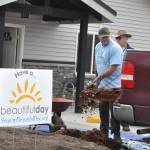 Sequim Gazette photo by Matthew Nash/ Volunteers placed bark and planted trees, bushes and flowers at LtCol Minsky Place on April 26 for Sequim Beautiful Day.