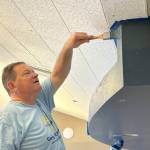 David Giller with Sequim Valley Foursquare Church paints a part of the Sequim Boys & Girls Clubs reception area on April 26 during the community project effort Sequim Beautiful Day. He was one of 150-plus volunteers from area churches to help with projects across Sequim.