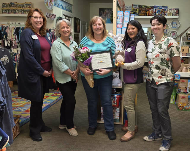 Photo by Beth Pratt| Susan Baritelle, center, owner of Dungeness Kids, was recently presented with a certificate honoring her as chamber Member of the Month for March by, from left, chamber board member Sarah Nicholls, staffer Melanie Sands, chamber board member Lara Stanton, and staffer Kendall Melton.