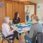Sequim Gazette photo by Emily Matthiessen
Cyndi Hueth leads a game of American Mahjong at the Harmony Center of Sequim, with manager Cassandra Cockrill standing at the entrance.