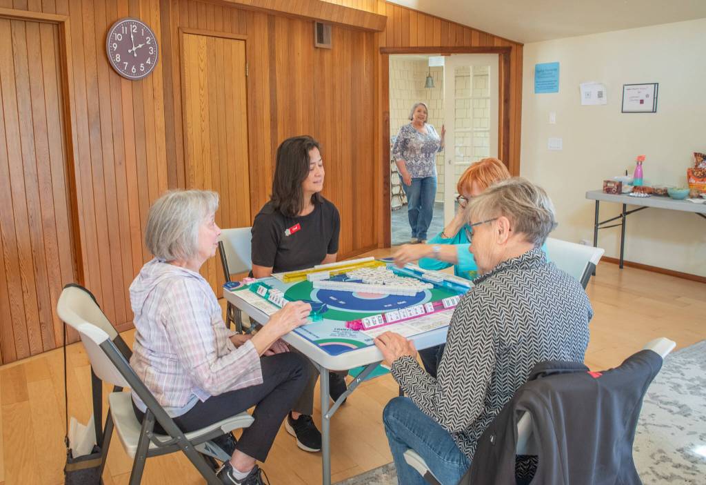 Sequim Gazette photo by Emily Matthiessen
Cyndi Hueth leads a game of American Mahjong at the Harmony Center of Sequim, with manager Cassandra Cockrill standing at the entrance.