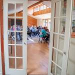 The entrance to the activities room at the Harmony Center of Sequim has a saying above the door that summarizes the dynamic of the place.