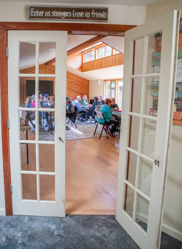 The entrance to the activities room at the Harmony Center of Sequim has a saying above the door that summarizes the dynamic of the place.