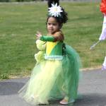 Sequim Gazette photo by Matthew Nash/ Avani Welch waves to the crowd during the Kids Parade.