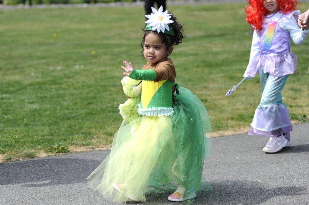 Sequim Gazette photo by Matthew Nash/ Avani Welch waves to the crowd during the Kids Parade.