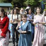 Sophia Treece and fellow cast members of Sequim High Schools Oklahoma! wave and hand out flyers to the show during the Kids Parade on May 3. The operetta plays four more shows at 7 p.m. Thursday-Saturday, May 8-10, and 2 p.m. Sunday, May 11 at Sequim High School.