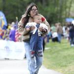 Sequim Gazette photo by Matthew Nash
Evin Atherton of Sequim brings Callum, 18 months, to watch the Kids Parade with dad Connor. The family said they live within walking distance of the park. Its wonderful to see everything the city offers, Connor said.