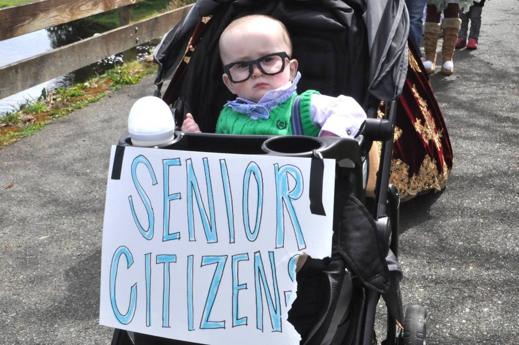 Sequim Gazette photo by Matthew Nash
Seventh-month-old Nash Dorcy cosplays as a senior citizen for the Sequim Irrigation Festivals Kids Parade. His mom Jessica Wilson said it seemed like a perfect costume because he looks like a little old man. After the parade, she said he did great and kept his glasses on.