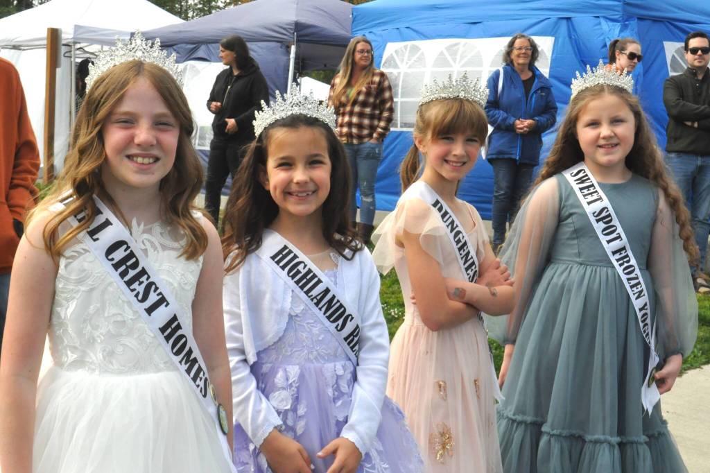 Sequim Gazette photo by Matthew Nash
This years Junior Royalty, from left, Savannah Fuller, Stella Good, Madelyn Davis, and Briella Gleason ready their smiles and waves for the Kids Parade on May 3. Theyll next appear in the Grand Parade on May 10.