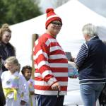 Sequim Gazette photo by Matthew Nash/ Isaac Eldred, 12, is spotted portraying Waldo at the Kids Parade on May 4. Hes participated in the parade in recent years as the Lorax and Dog Man, his mom said.