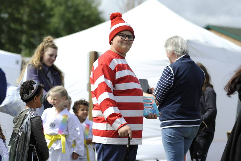 Sequim Gazette photo by Matthew Nash/ Isaac Eldred, 12, is spotted portraying Waldo at the Kids Parade on May 4. Hes participated in the parade in recent years as the Lorax and Dog Man, his mom said.