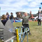Sequim Gazette photo by Matthew Nash/ Children catch balls from Sequim Robotics Federations robot Jugglejaw on May 3. The robot and Sequim High School students will participate in the Grand Parade on May 10.