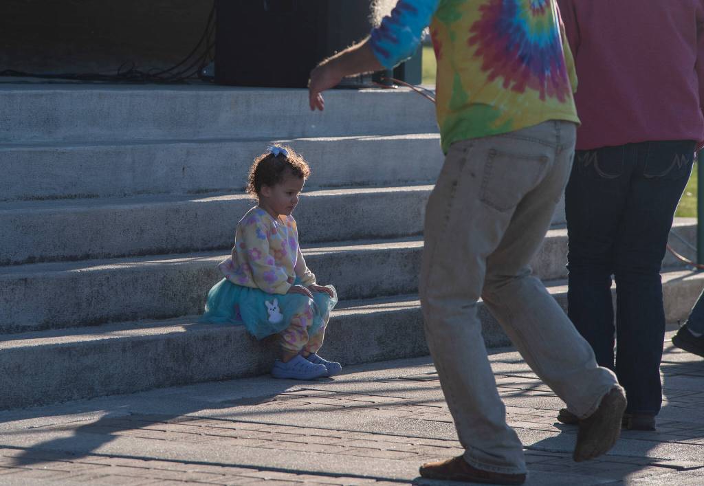 Sequim Gazette photo by Emily Matthiessen
 The adults dance to Black Diamond Junction on Saturday evening, while three-year-old Ember Johnson has a contemplative moment.