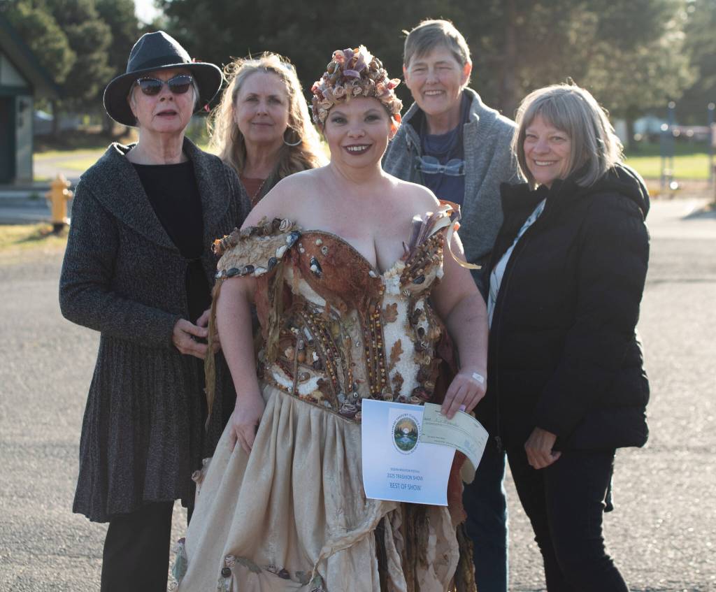 Sequim Gazette photo by Emily Matthiessen
 Trashion Show participant Aja Alexander won Best in Show for her dress, which she also modeled. The dress was named Fragments, symbolizing Alexander rebuilding her life, and is composed of many elements, including large pieces of seaweed, shells, corn husks and kernels all glued or sewn with fishing line onto material ripped apart from past garments.