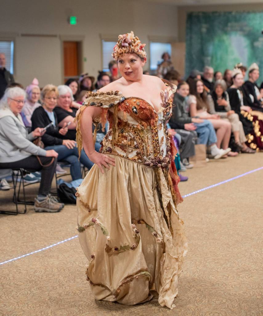 Sequim Gazette photo by Emily Matthiessen/ Trashion Show participant Aja Alexander won Best in Show for her dress, which she also modeled. The dress was named Fragments, symbolizing Alexander rebuilding her life, and is composed of many elements, including large pieces of seaweed, shells, corn husks and kernels all glued or sewn with fishing line onto material ripped apart from past garments.