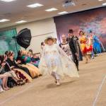 Sequim Gazette photo by Emily Matthiessen/ Taylor Downing leads other models in the Irrigation Festivals Trashion show on Sat. evening at the Guy Cole Events Center.