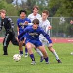 Sequim Gazette photo by Emily Matthiessen/ Sequims Finn Braaten (5) and Evan Cisneros (17) battle for the ball against Port Angeles Sawyer Davis (6). Port Angeles goalkeeper Gus Halberg (1) is also in on the play. Sequim won 1-0 Friday in Sequim.