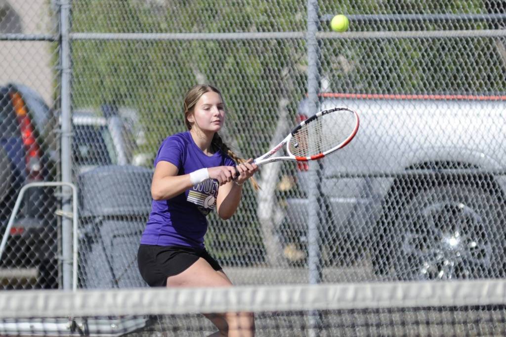 Sequim Gazette photo by Matthew Nash/ Sequims Calleigh Thompson returns a hit on May 3 against Pyper Alton of Bremerton. Thompson won 6-0 in two sets.