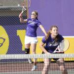 Sequim Gazette photo by Matthew Nash/ Sequims Sasha Yada makes a hit as doubles partner Kristine Prorok looks on during a match on May 2.