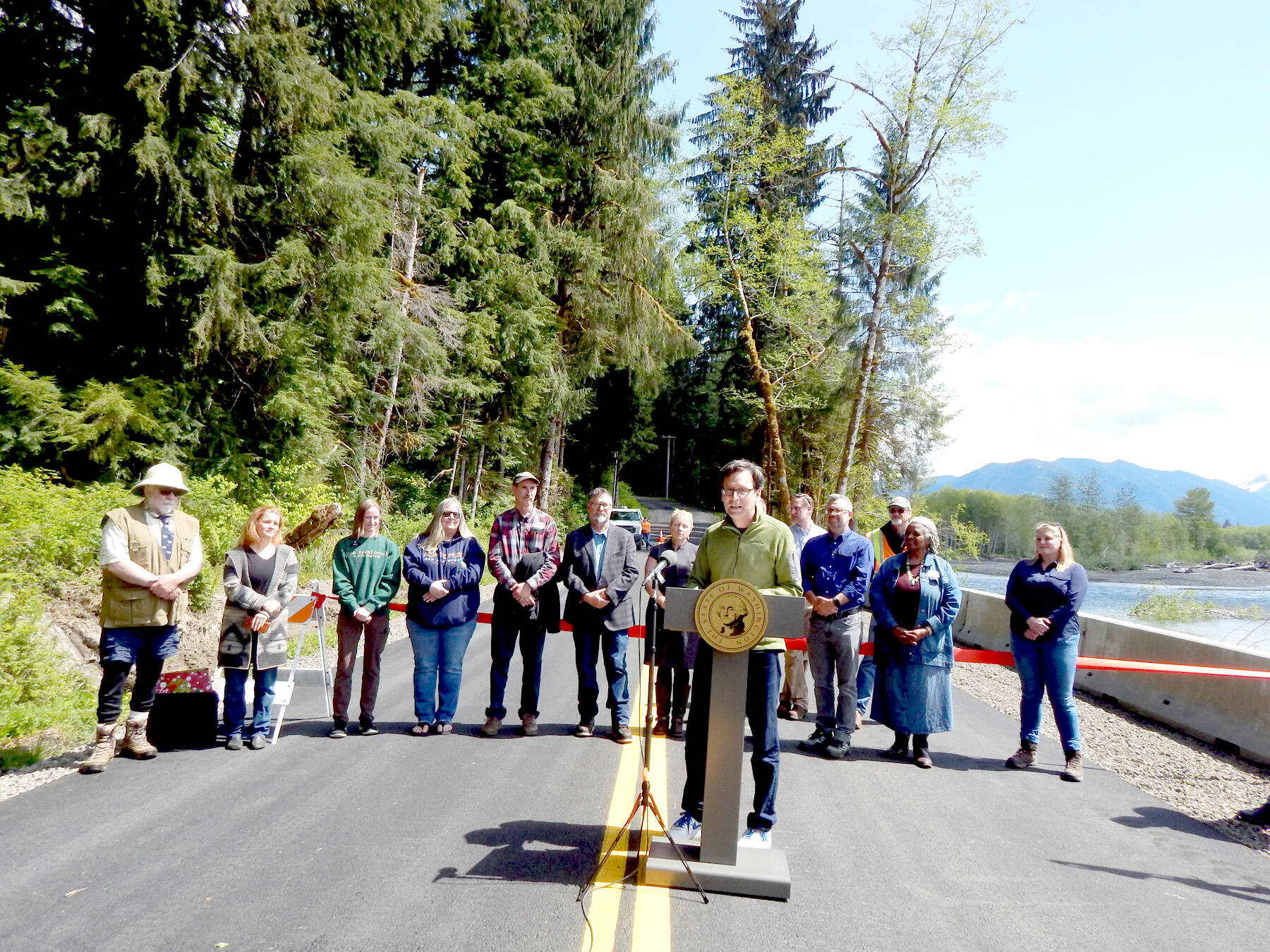 Olympic Peninsula News Group photo by Christi Baron| Gov. Bob Ferguson and other officials reopen Hoh Road in a ceremony on Thursday, May 8 in time for the summer tourism/vacation season. The road was closed for several months due to a washout.