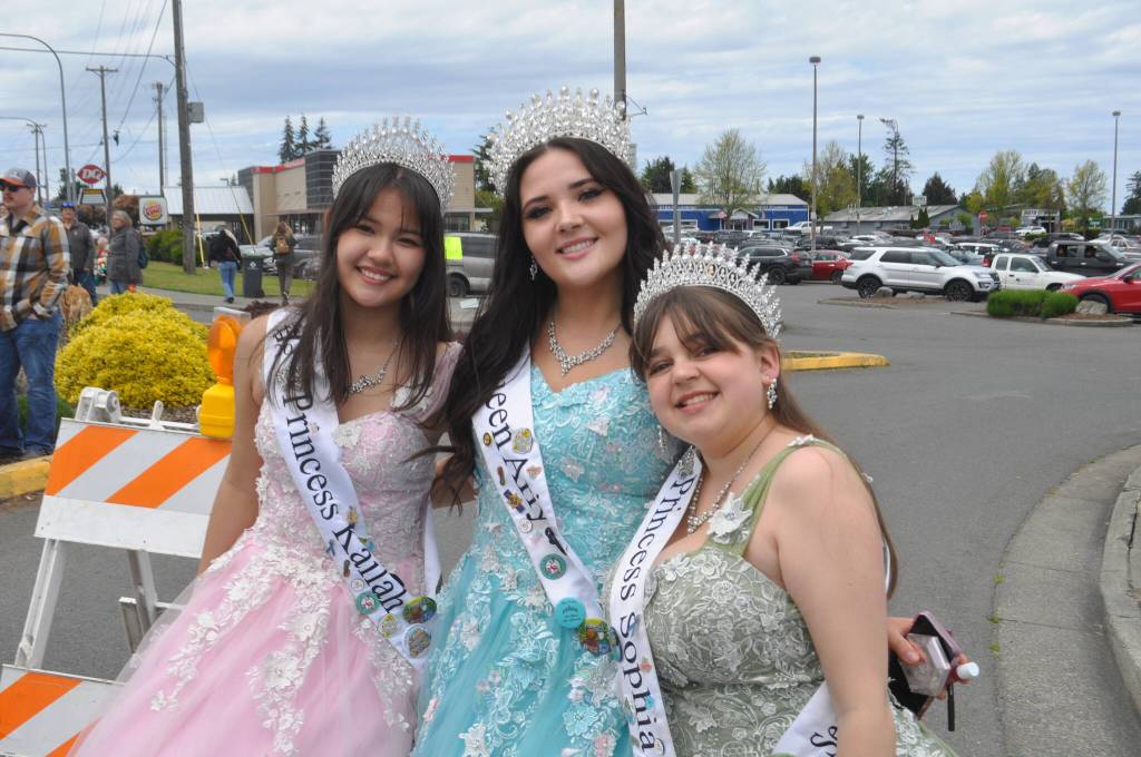 Sequim Gazette photo by Matthew Nash
Irrigation Festival royalty from 2024, from left, Kailah Blake, Ariya Goettling, and Sophia Treece, not pictured Ashlynn Northaven, celebrate at the end of the Grand Parade on May 10.