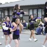 Sequim Gazette photo by Matthew Nash/ Sequim High Schools cheer squad performs a routine for the crowd near downtown Sequim.