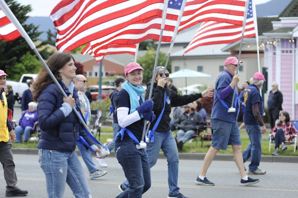 Sequim Gazette photo by Matthew Nash/ Nell Clausen and fellow members of the Sequim Sunshine Rotary and Sequim High School Interact Club promote the Flag Subscription program where they place about 650 U.S. flags on five holidays  Presidents Day, Memorial Day, the Fourth of July, Labor Day and Veterans Day.