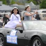 Sequim Gazette photo by Matthew Nash/ Junior Royalty princesses Stella Good and Briella Gleason wave to spectators at the Grand Parade.