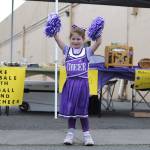 Sequim Gazette photo by Matthew Nash
Five-year-old Autumn Madison shares a cheer with passers-by of the Sequim Wolf Pack and Cheer fundraising booth during the Sequim Irrigation Festival on May 10.